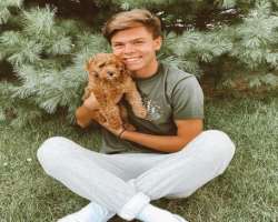 Caleb loves to play with his dog Bella Rose in his free time.